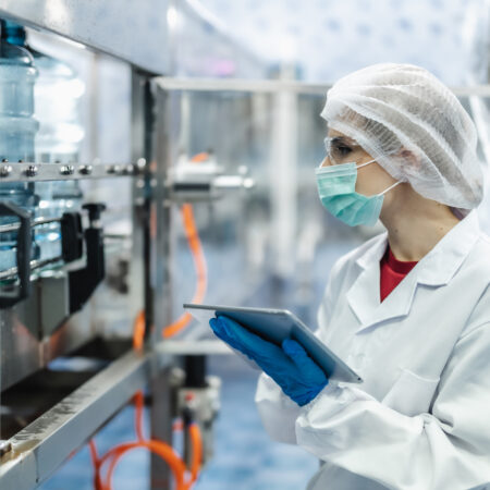 Worker people working in Drinking water factory, Hygiene uniform cleanliness workplace with clean care.